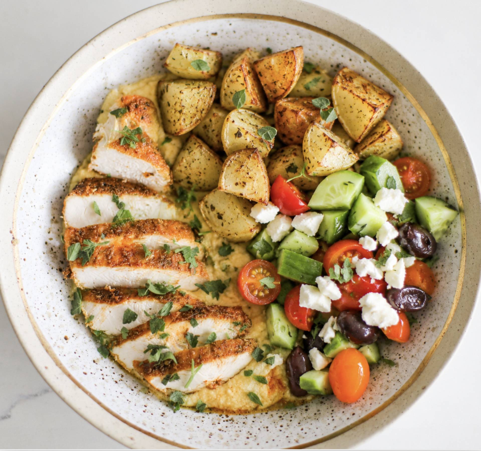 Greek Chicken Thighs with Lemon Oregano Potatoes and Cucumber Salad