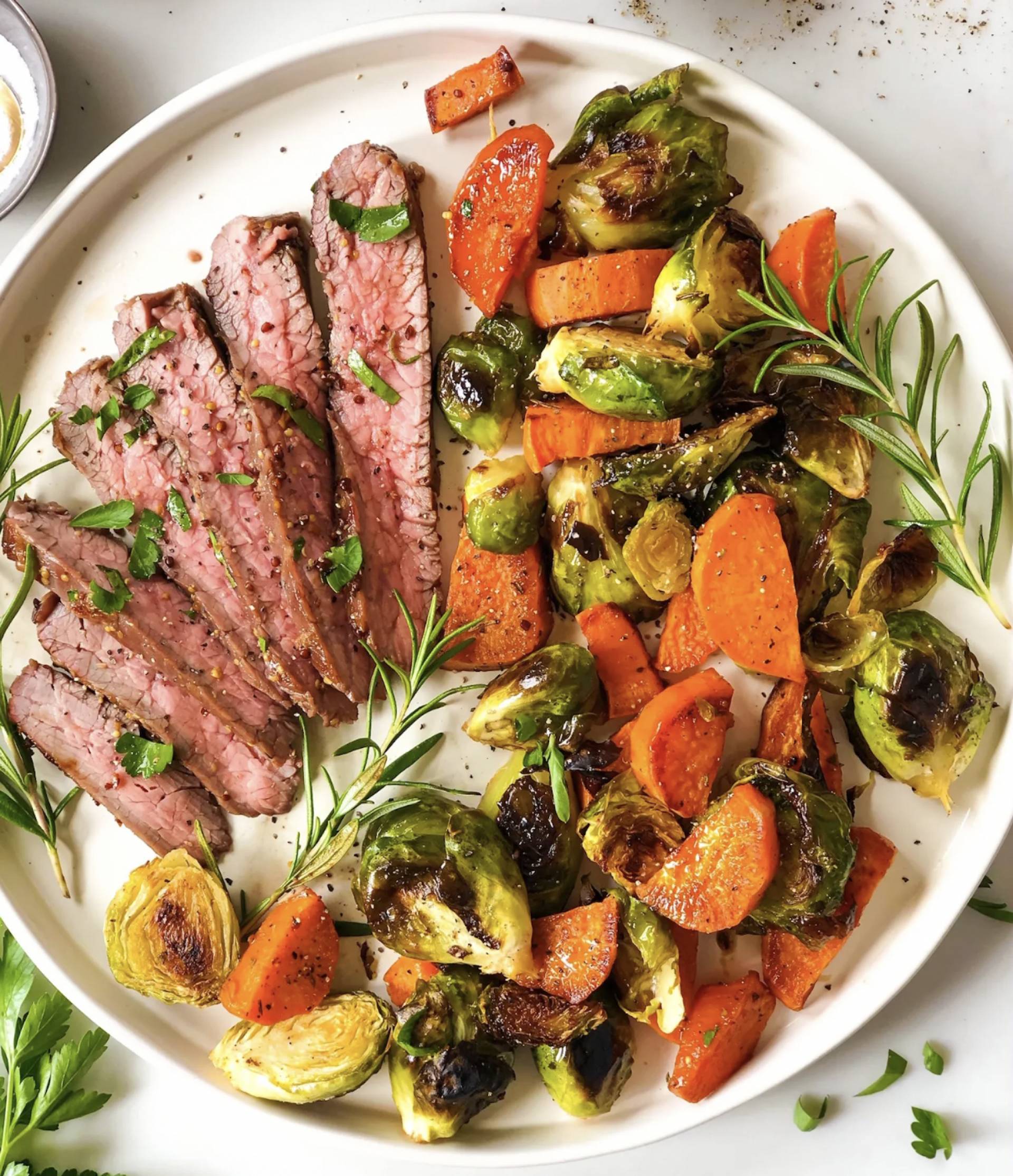 Truffle Herb Buttered Flank Steak with Roasted Brussels and Carrots