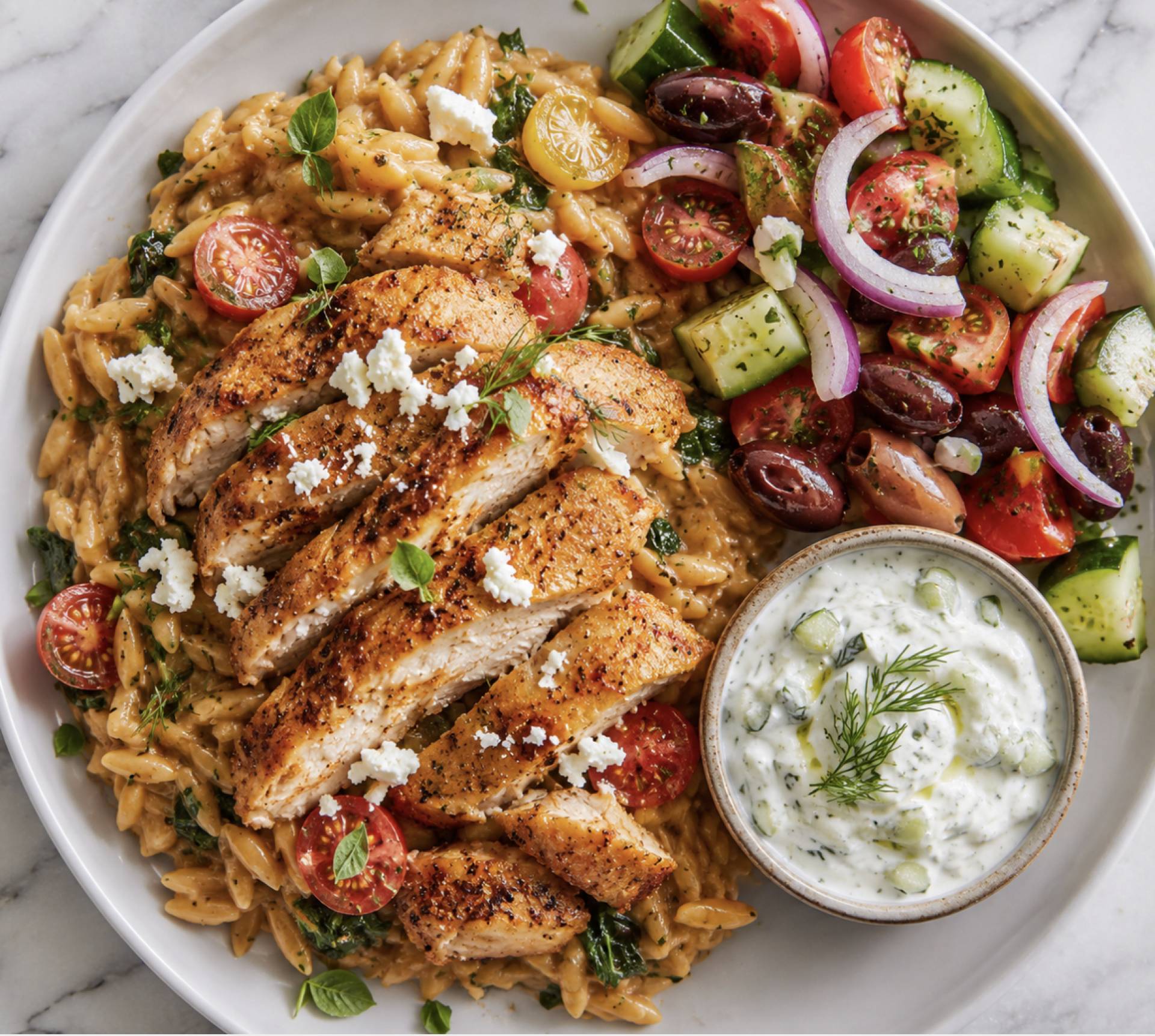 Greek Chicken Thighs with Lemony Orzo and Cucumber Salad